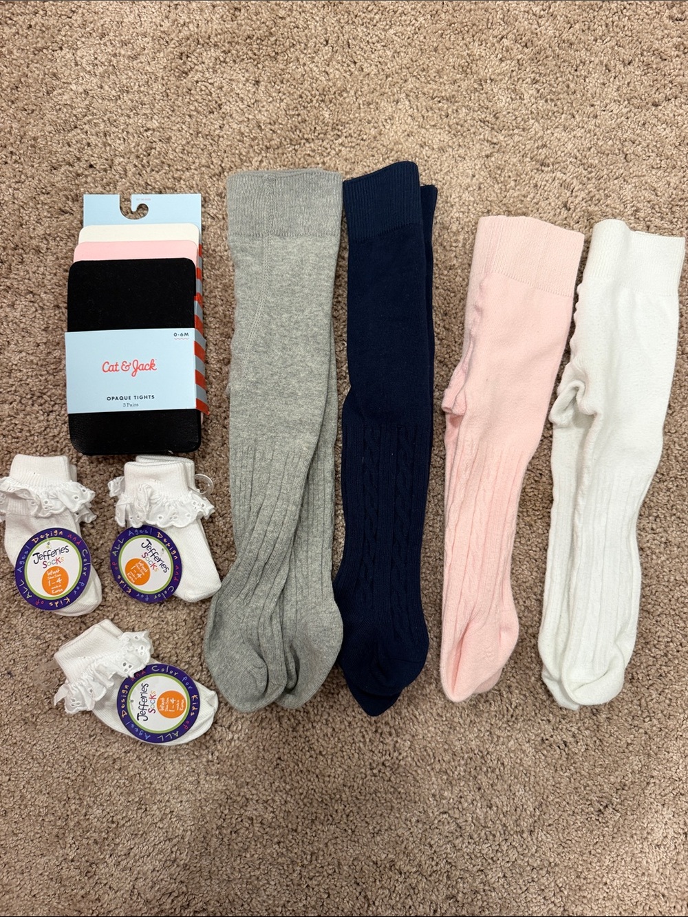 Newborn bundle of socks, tight, and leggings